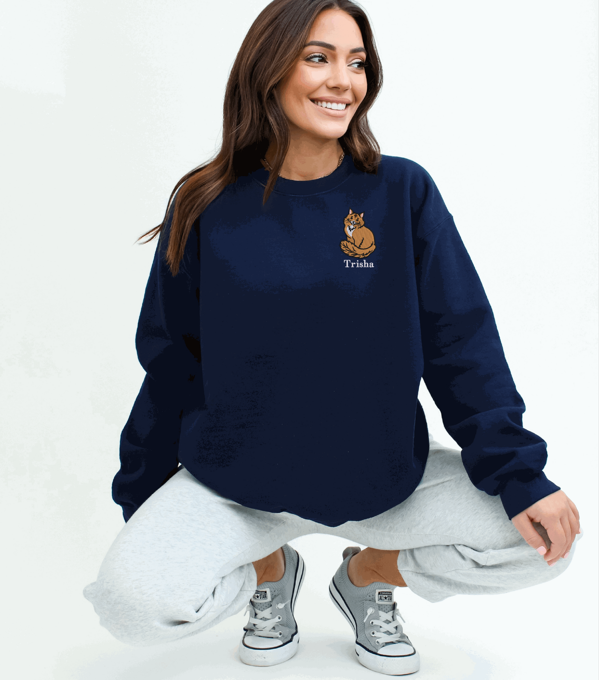 a woman sitting on the ground with her legs crossed