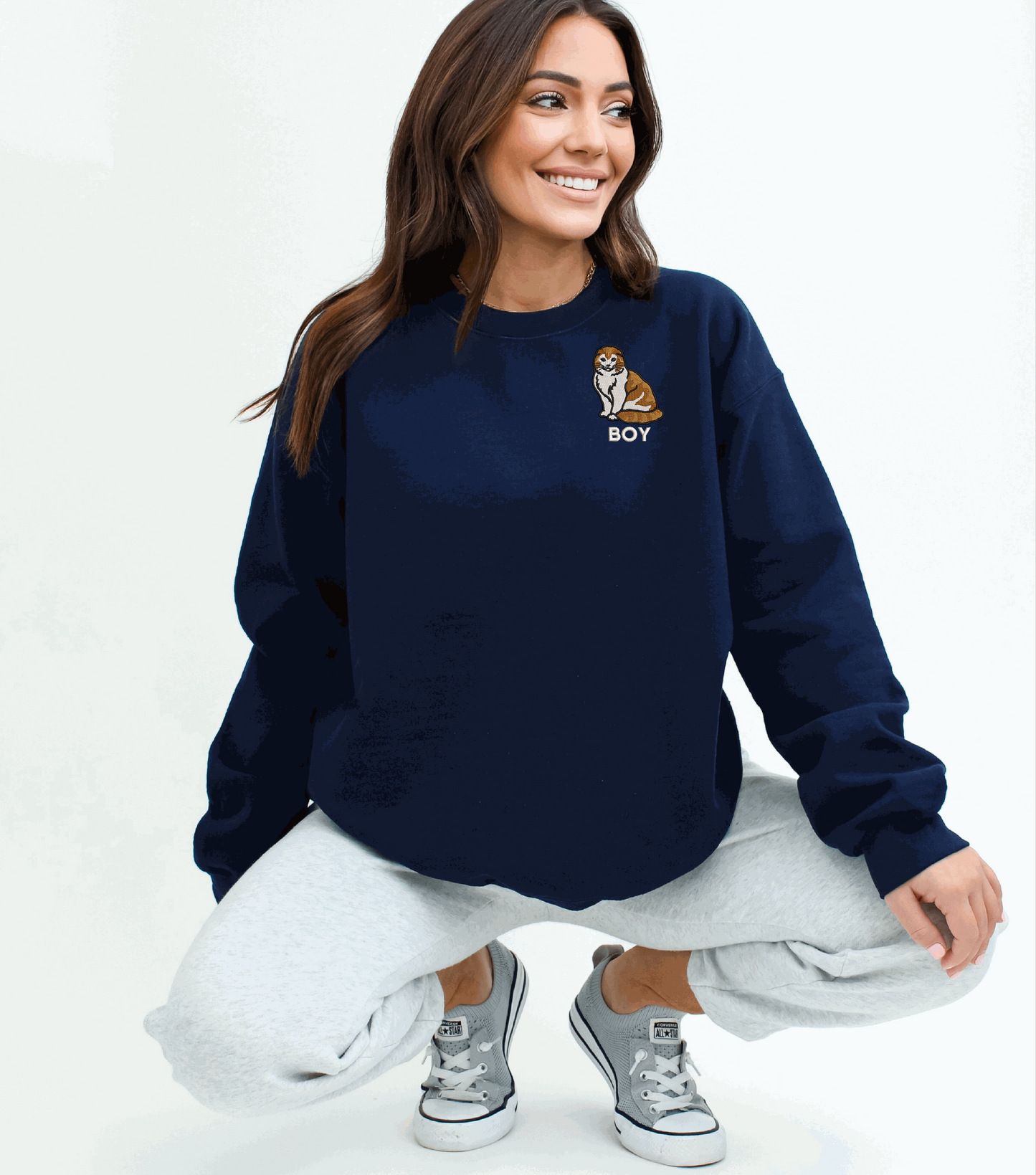 a woman sitting on the ground with her legs crossed
