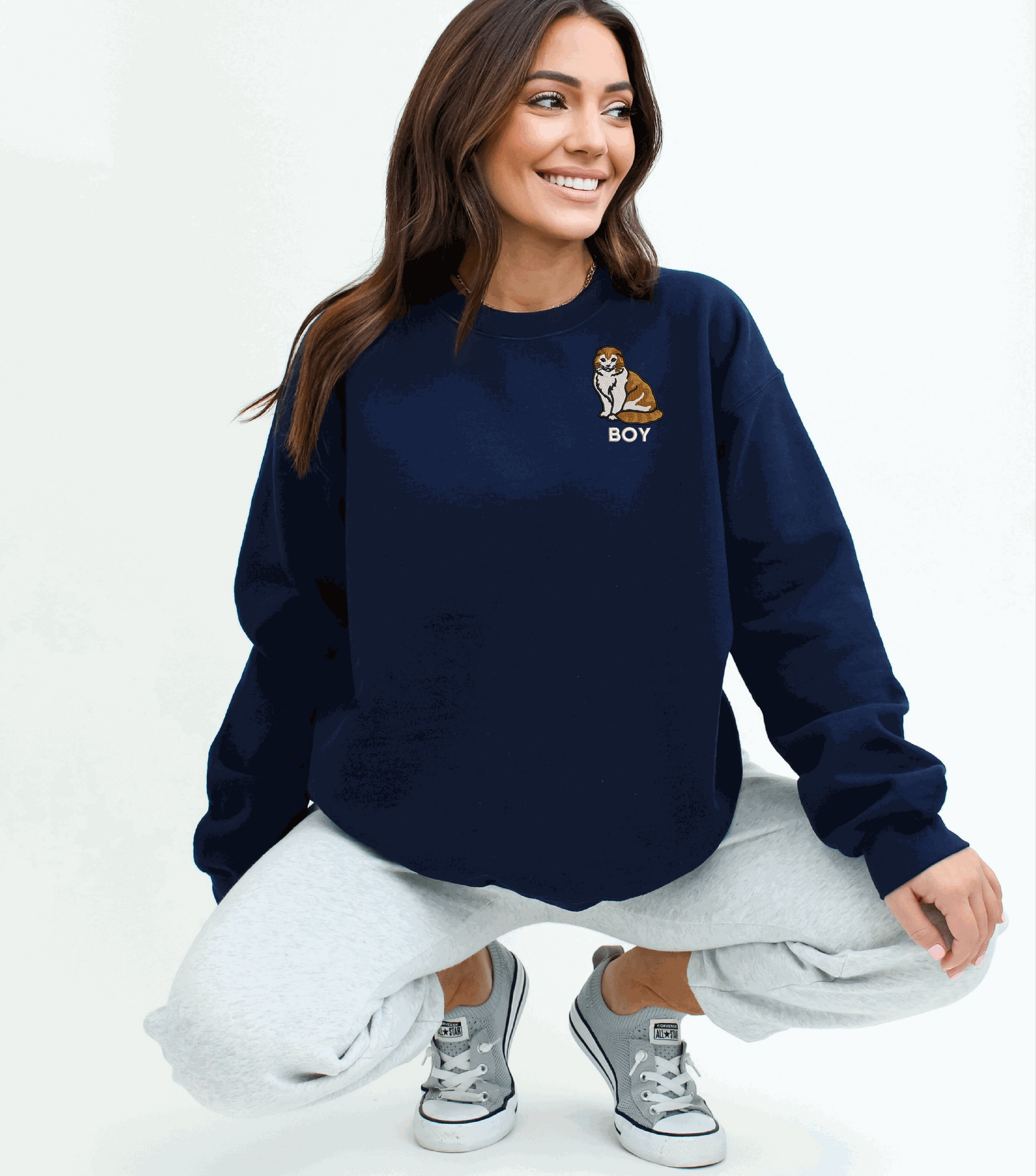 a woman sitting on the ground with her legs crossed